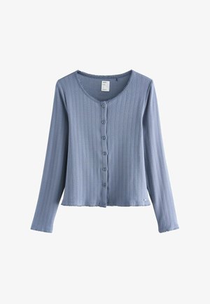 Ljusblå ribbad kofta med långa ärmar, rund halsringning och sex knappar framtill. Avslutad med en vågig fåll och textur.