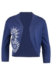 Laivastonsininen lyhyt neuletakki pitkillä hihoilla, jossa vasemmalla puolella valkoinen kukkakuvio. Pehmeä neulepinta ja avoin edusta.