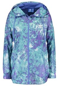 Lightweight waterproof jacket in shades of teal and purple, featuring a fern pattern, front zipper, adjustable hood, and elastic cuffs.