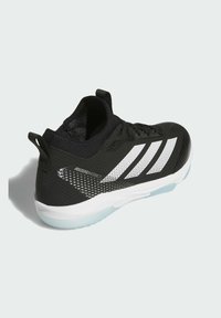 Black athletic shoe with white accents, mesh upper, textured pattern, and translucent sole. Features a pull tab at the back.