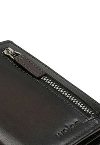 Black leather wallet features a silver zipper with a metal pull tab, smooth texture, and embossed logo. Compact and rectangular shape.