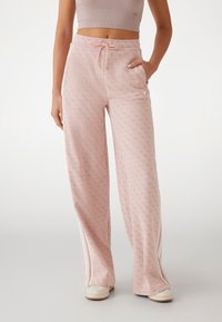 Guess LOGO STRAIGHT - Träningsbyxor - rose