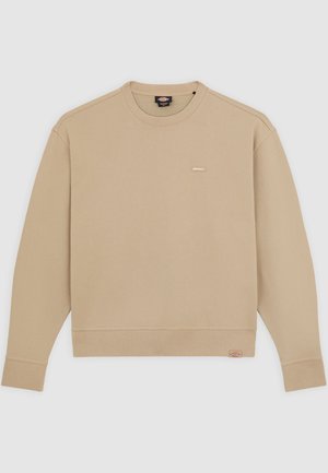 Beige sweatshirt met een ronde hals, ribgebreide manchetten en onderkant. Heeft een klein merkembleem op de borst. Gemaakt van zacht katoen.