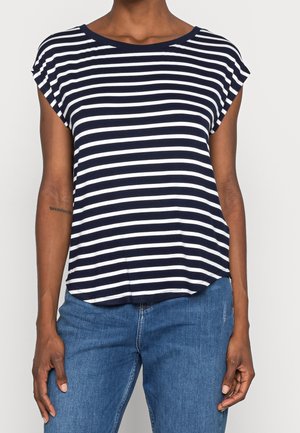 Navy blue and white striped short-sleeve top with a rounded neckline, soft fabric, and a slightly curved hem. Worn with blue jeans.