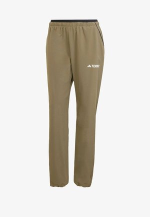 Harmaansävyiset urheiluhousut, joissa on joustava vyötärö, mustat yksityiskohdat ja Terrex-logo painettuna valkoisena vasempaan reiteen. Sileä pinta.