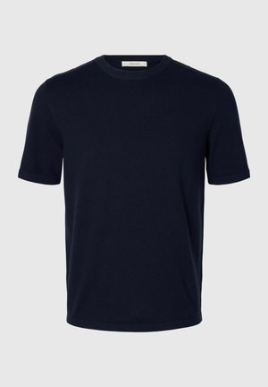 Tumesinine lühikeste varrukatega ümara kaelusega puuvillane T-särk, kitsas lõige, ilma nähtavate mustrite või logodeta.