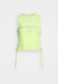 Crop top sans manches vert fluo avec des lacets latéraux et un motif cœur en strass où est inscrit « Juicy » sur le devant.