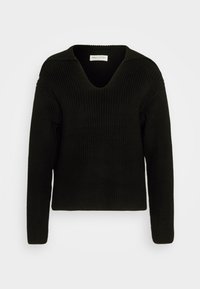 Maglione nero a coste con scollatura a V profonda e maniche lunghe, realizzato in un materiale spesso e accogliente, esposto su uno sfondo chiaro e uniforme.