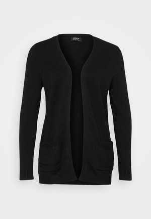 Mustan neuletakin V-pääntie, avoin etuosa, pitkät hihat ja kaksi etutaskua ribbireunuksilla. Valmistettu pehmeästä neuloksesta.