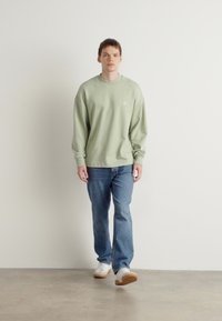 HUGO NINNYO - Felpa - light pastel green