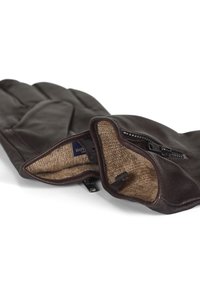 Brune skinnhansker med glidelåsåpning, foret med beige stoff. Har en myk tekstur og et stilrent, enkelt design.