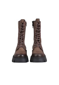 Brown leather lace-up boots with a chunky black sole, featuring a side zipper and vertical stitching detail.