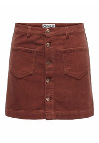 Minifalda de pana en rojo óxido, con bolsillos delanteros, corte recto y cierre con botones metálicos.