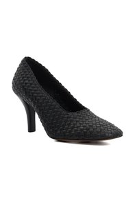 Black woven leather high heel shoe with a pointed toe, slim heel, and textured surface, featuring a low-cut vamp and smooth lining.