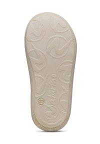 Beige rubberen schoenzool met tekstuur voor grip, met cirkelvormige logopatronen en een gouden "20" detail. Glad afgewerkt en verhoogde accenten.