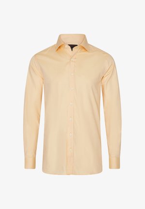 Lysegul langærmet skjorte lavet af glat stof, med krave, fuld knaplukning og knapmanchetter.