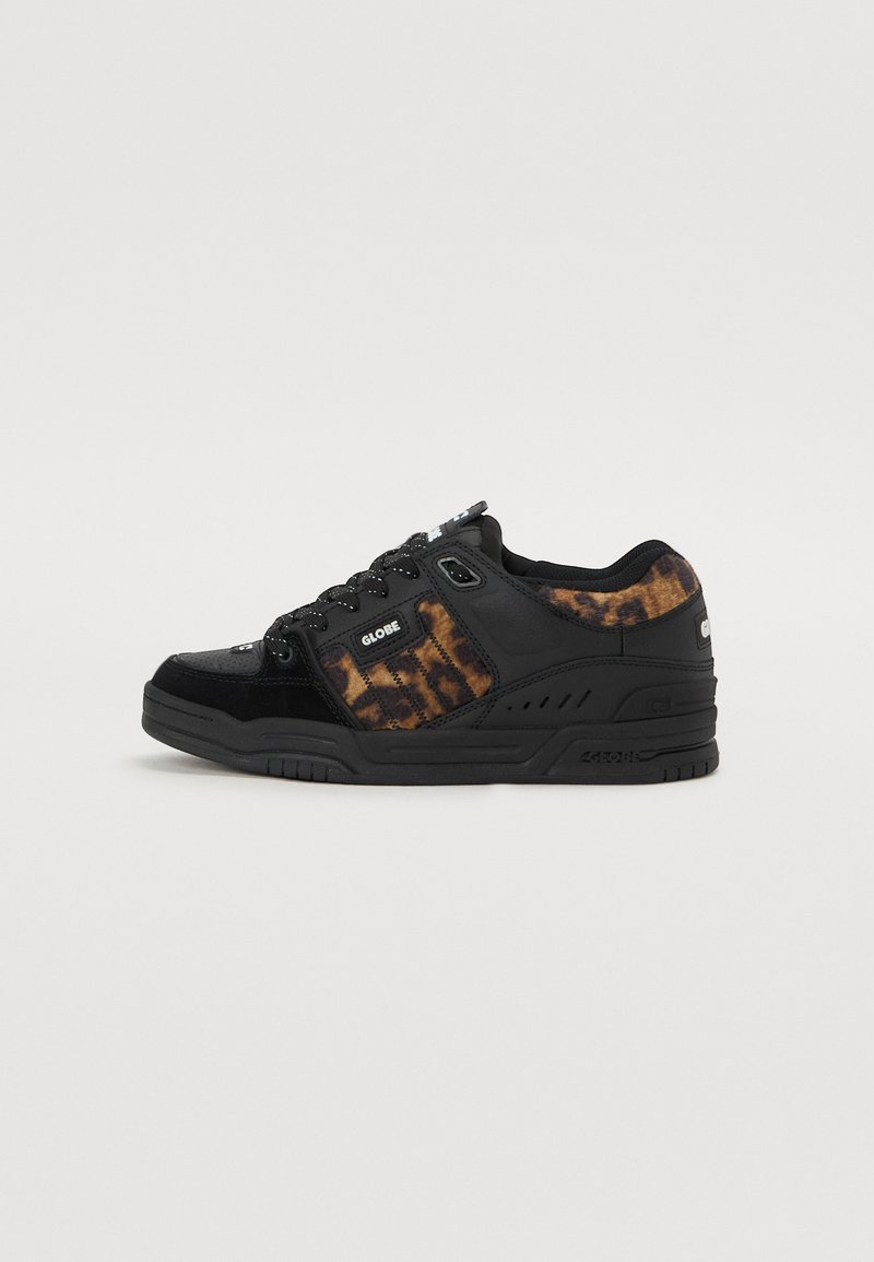 Black sneaker with textured leopard-print accents, featuring a suede upper, rubber sole, and lace-up design. Hardware includes logo details.