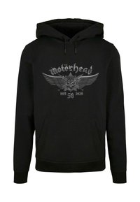 Must musta, millel on eesmine tasku. Omab graafikat koljust koos tiibadega ning halli teksti "Motörhead 1975 58 2025".