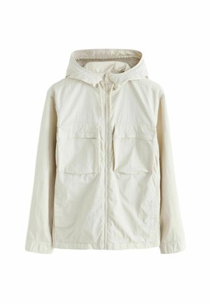 Lichtbeige ritsjack met capuchon, voorzien van twee voorkruiszakken, een gestructureerde stof en elastische manchetten voor een snug fit.