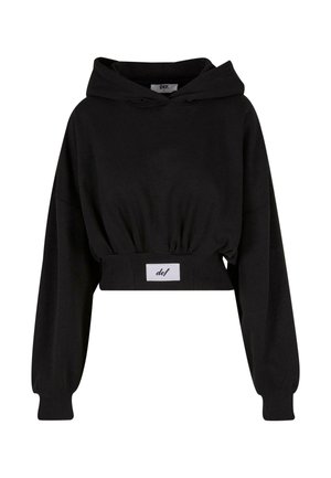 Haut à capuche noir court en coton doux. Doté d'une capuche avec cordon de serrage, de manches longues et d'une étiquette cousue à la taille.