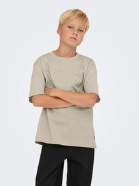 Beige bomulds T-shirt med rund hals, korte ærmer og en afslappet pasform. Stofset ser glat ud uden synlige mønstre.
