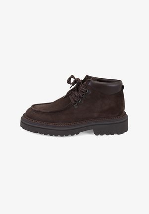 Brown suede ankle boot with padded collar, thick treaded sole, and round patterned laces tied in a knot on a white background.