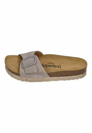 Light brown suede slide sandal with adjustable buckle strap, cork footbed, textured sole, and branding on insole.