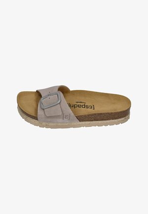 Light brown suede slide sandal with adjustable buckle strap, cork footbed, textured sole, and branding on insole.