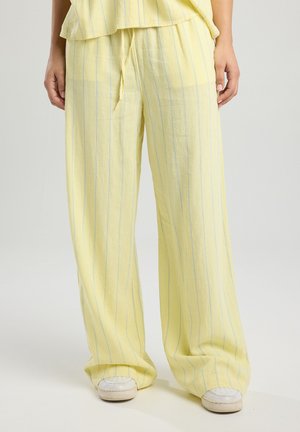 Pantaloni in lino giallo chiaro con righe blu verticali, design a gamba larga, vita elastica e dettaglio con lacci.