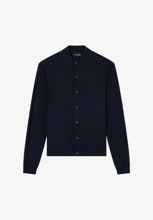 Cardigan blu navy con collo a camicia, maniche lunghe e chiusura frontale con bottoni. Tessuto lavorato a maglia con trama e polsini e orlo a coste.