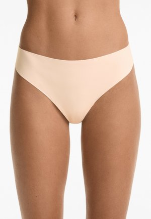 Beige bikini briefs with smooth, stretch fabric. The design features a high-cut leg and a seamless waistband for comfort.