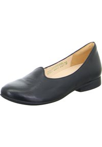 Scarpa piatta nera in pelle con punta tonda, tacco basso e texture liscia. L'interno presenta una fodera beige con dettagli del marchio.