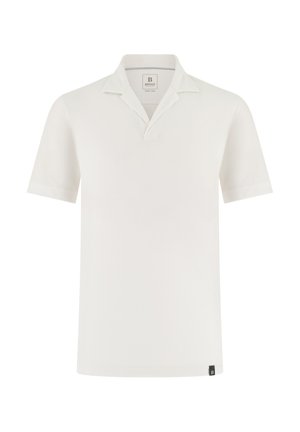 Polo blanc à manches courtes avec col ouvert, petite étiquette noire à l'ourlet et étiquette de la marque à l'intérieur de l'encolure.