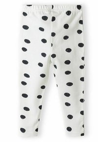 Balti leggings su juodais taškeliais, pagaminti iš minkštos medžiagos, su elastinga juosmens juosta ir siaurėjančiomis kojomis.