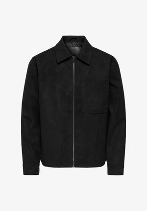 Črna suknja iz nubuk usnja z zapiranjem na zadrgo, ovratnikom in žepom na levi strani prsi; ima gladko teksturo in prilegajoč dizajn.