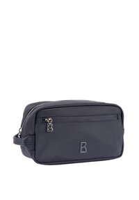 Mørkeblå toilettaske lavet af holdbart nylon, med lynlåslomme foran, sidelæder og præget logo på fronten.