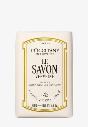 Saponetta corpo extra delicata alla verbena di L'Occitane, confezione crema con bordo dorato, peso indicato frontalmente 250g (8,8 oz).
