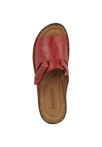 Red leather slide sandal with perforated strap design, padded tan insole, and stitched detailing. Rounded toe and soft finish.