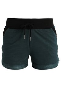 Tmavě zelené sportovní šortky s širokým černým elastickým pasem a černou šňůrkou, s bočními kapsami a opatřenými manžetami.