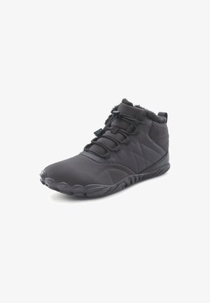 Black mid-top shoes with a textured finish, fur lining, adjustable laces, and a flexible rubber sole, designed for comfort and support.