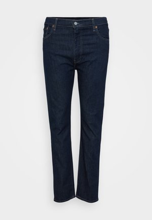 Dunkelblaue gerade geschnittene Jeans mit vorderem Knopf- und Reißverschluss, Vorder- und Gesäßtaschen, auf einem weißen Hintergrund präsentiert.
