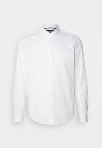 Weißes Langarm-Hemd aus Baumwolle mit Button-Down-Kragen und durchgehender Knopfleiste. Mit einem dezenten Logo auf der linken Brust. Glatte Textur.