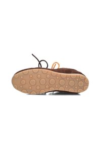 Brown suede shoe with a textured tan rubber sole featuring circular patterns. The laces are dark brown with bright orange accents.