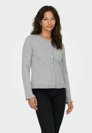 Cardigan en tricot gris avec manches longues, fermeture à boutons, poignets côtelés et ourlet en dentelle. Texture douce, coupe ajustée et design minimaliste.