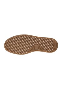 Semelle de chaussure avec un motif de crampons triangulaire, talon arrondi et le nom de la marque "Tamaris" embossé près de l'arche.