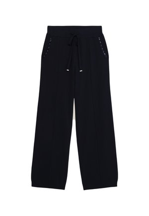 Bredde ben sweatpants i navy stof med snoretræk i taljen og shiny metaldetaljer på sidelommerne. Glat tekstur og afslappet pasform.