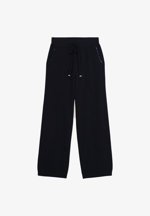 Bredde ben sweatpants i navy stof med snoretræk i taljen og shiny metaldetaljer på sidelommerne. Glat tekstur og afslappet pasform.