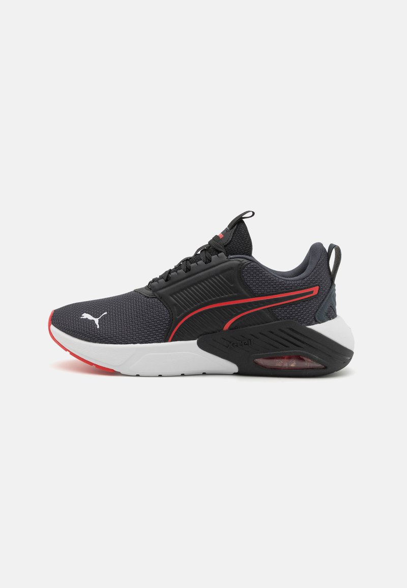 Puma sneakers featuring a black mesh upper with red accents, a white midsole, and a visible air unit in the heel. Textured side panels visible.