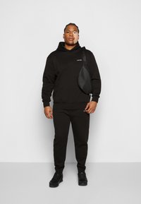 Calvin Klein MICRO LOGO JOGGER - Træningsbukser - black