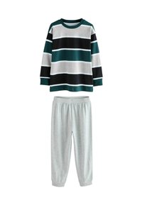 Langärmliges Shirt mit breiten horizontalen Streifen in Schwarz, Grau, Weiß und Grün, kombiniert mit schlichten hellgrauen Hosen mit elastischem Bund.